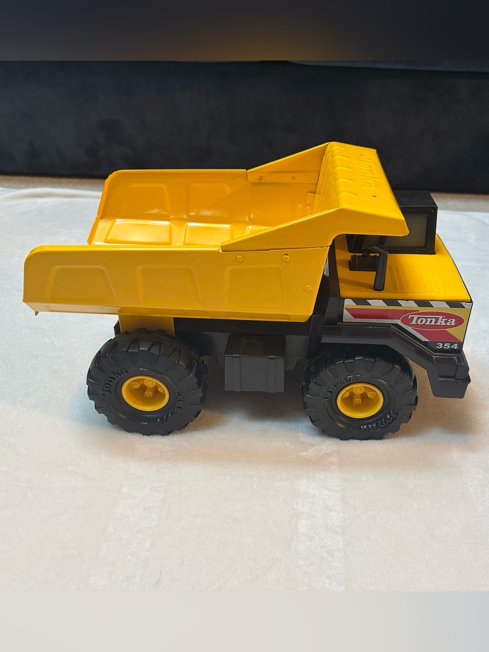 Tonka Mighty Dump Truck #354 Pressed Steel Yellow Construction Toy 2012